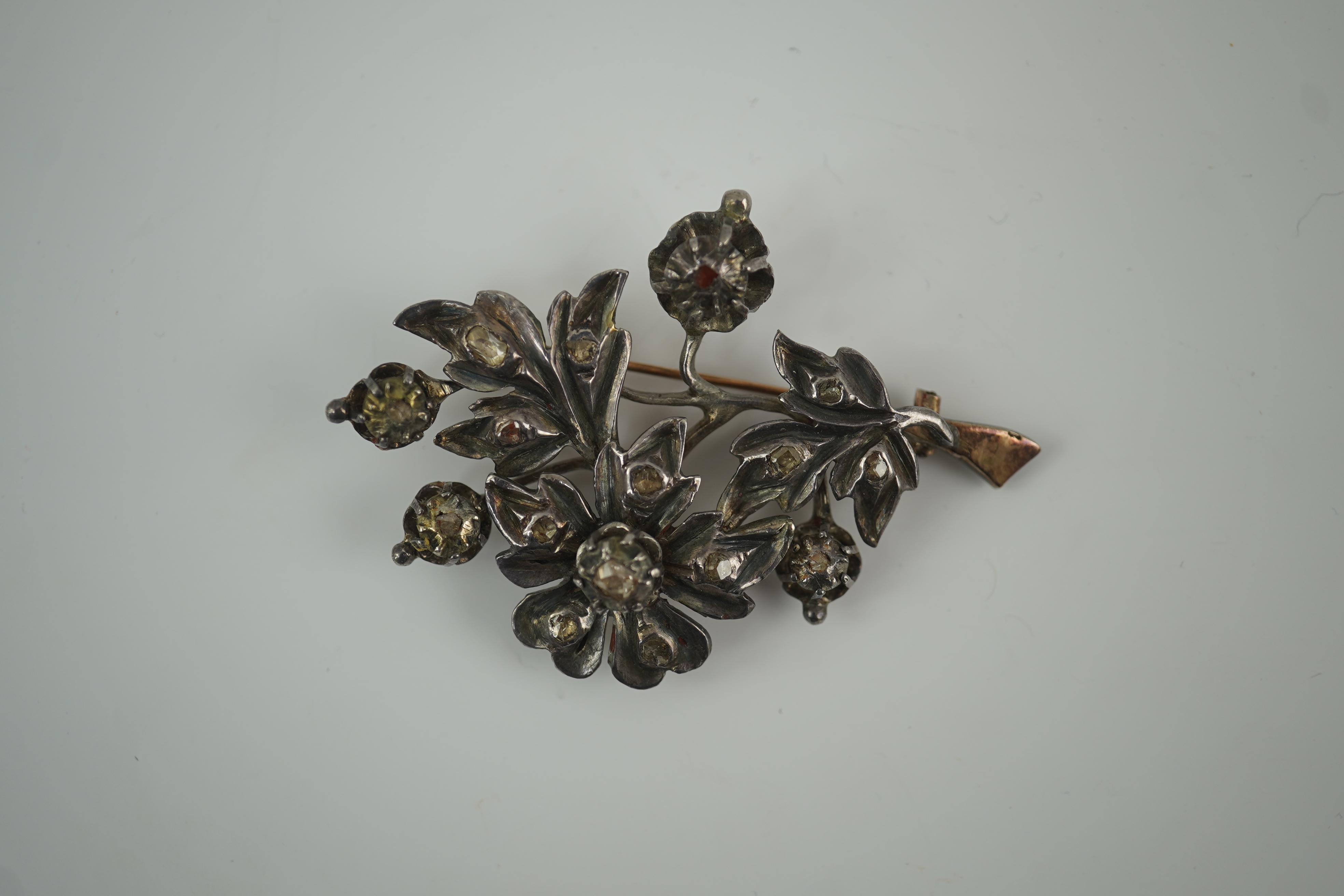 A Victorian gold overlaid silver and rose cut diamond set floral spray brooch